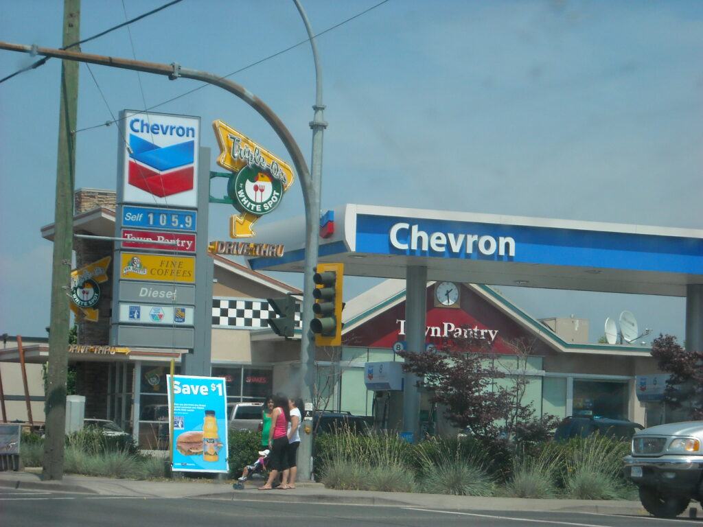 Chevron Gas Station - 757 Biz Click Chevron gas station sign with the Chevron logo and fuel price board on a bright day