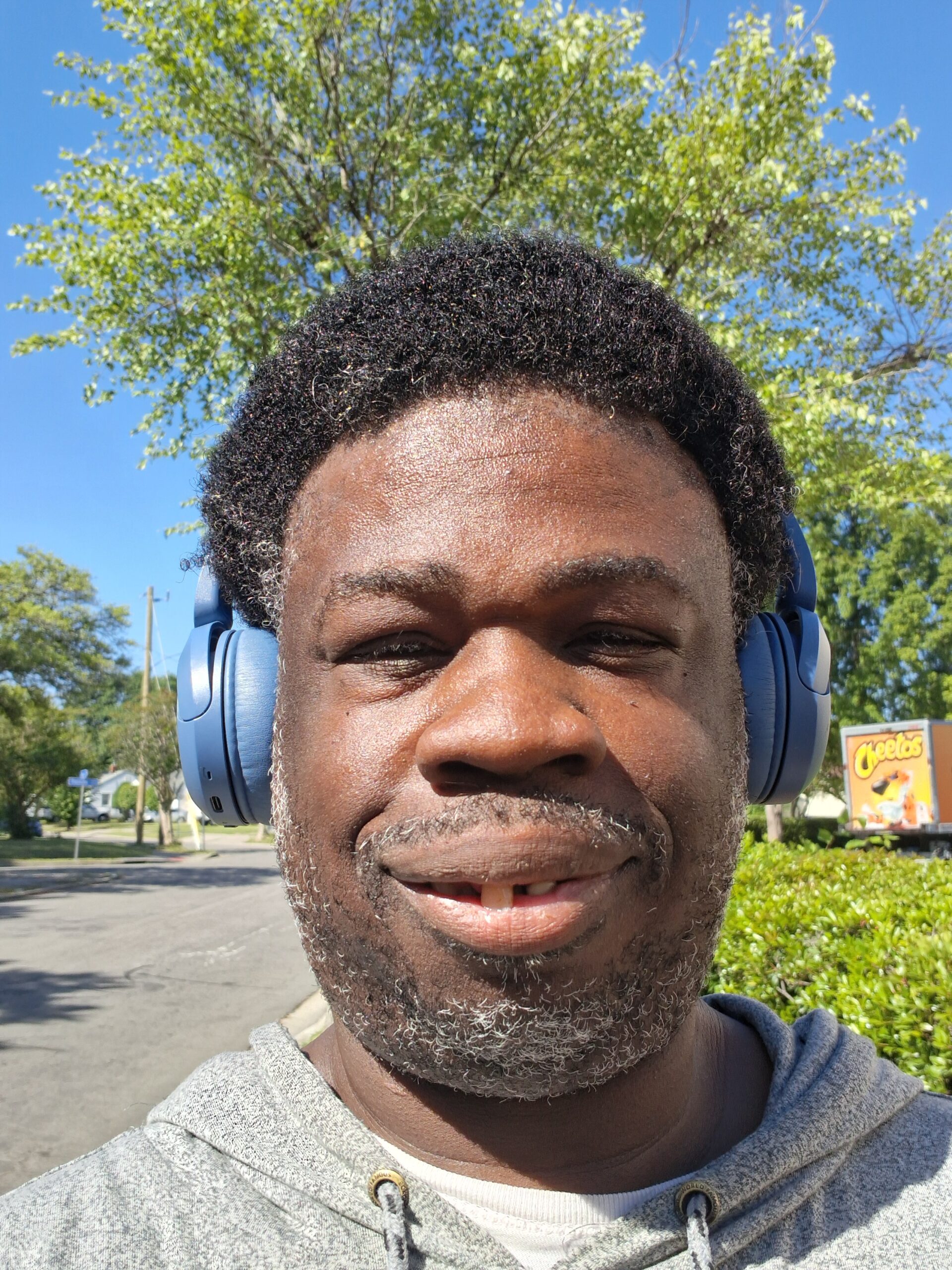 Cedric outdoors smiling after Pro-Line Comb Thru treatment